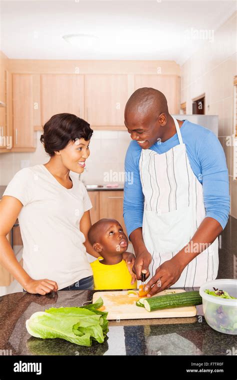 happy African American family of three cooking in home kitchen Stock Photo - Alamy