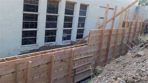 Veterans concrete,..retaining wall form work progress - YouTube