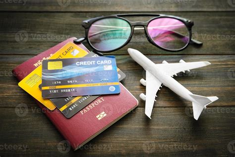 Passport and credit card on wooden desk 11388710 Stock Photo at Vecteezy