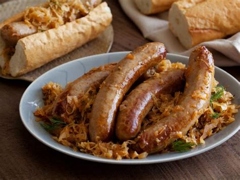 Bratwurst Stewed with Sauerkraut Recipe | Michael Symon | Food Network