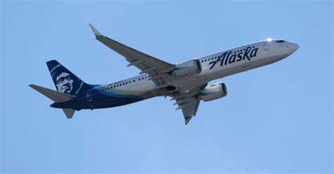 Passenger arrested, charged after Alaska Airlines flight makes ...