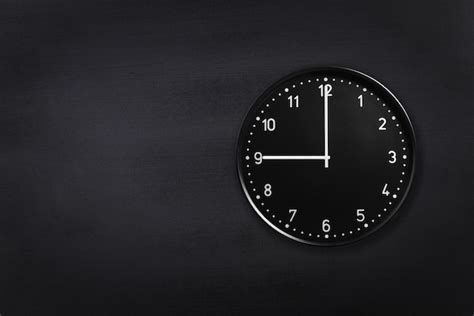 Premium Photo | Wall clock showing nine o'clock on black chalkboard background office clock ...