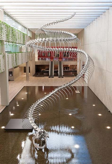 A Giant Aluminum Snake Skeleton Rises from a Pool of Water at the Queensland Art Gallery — Colossal