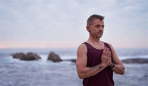 Man Meditating during Yoga Practice by the Ocean at Dusk Stock Photo - Image of meditating ...