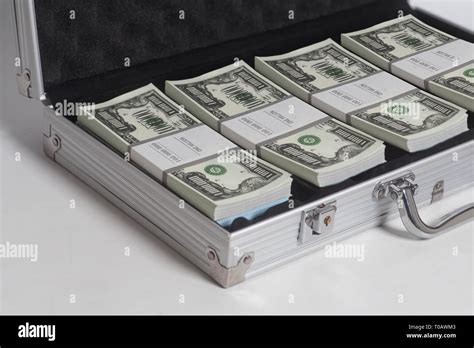 Open suitcase with one million dollars bills stacks on white background Stock Photo - Alamy