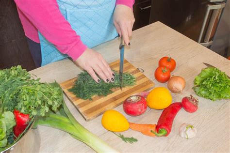 Woman Cooking Healthy Meal in the Kitchen. Cooking Healthy Food at Home Stock Image - Image of ...