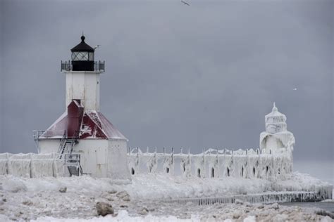 Bizarre ice formations engulf frozen lighthouse in Michigan, in pictures