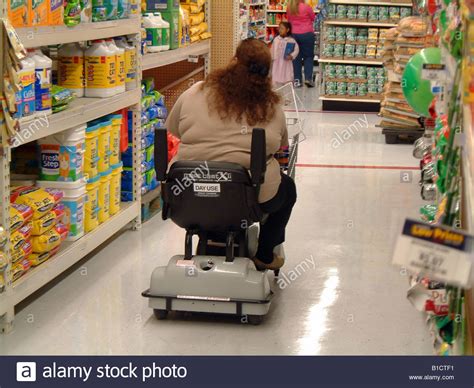 Fat obese woman on an electric shopping cart Wal Mart USA WalMart Stock ...