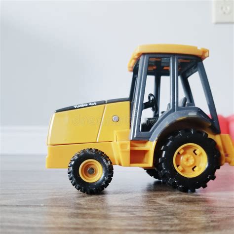 Yellow toy tractor stock photo. Image of construction - 157919862