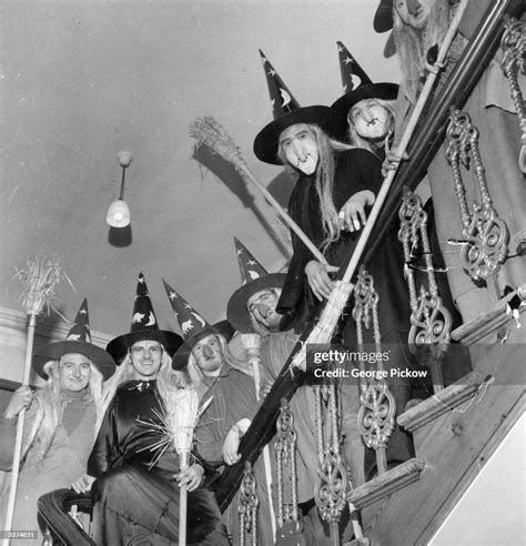 A group of men in costume as witches, complete with brooms, to... News Photo - Getty Images