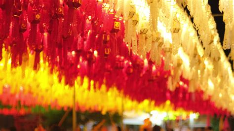 Colorful Lanna paper lanterns hang in Lamphun temples at night. Popular lantern festival during ...