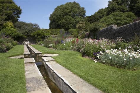 Garden with Water Mill Wheel Stock Photo - Image of flowing, mill: 122018