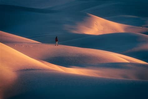 Premium Photo | Man walking on desert