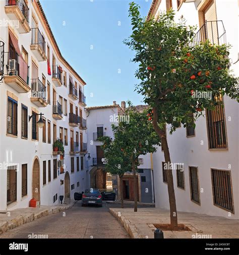 Typical narrow street in municipal town of Pego in the Province of Alicante Spain Stock Photo ...