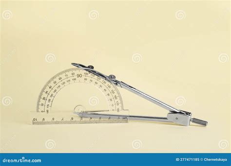 Protractor and Metal Compass on Yellow Background Stock Image - Image ...