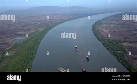 Dry Bulk Cargo Barges Floating In The Amba River In Dolvi, Maharashtra Stock Video Footage - Alamy