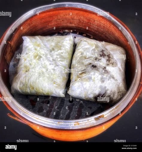 Dim sum sticky rice wrapped in lotus leaf Stock Photo - Alamy