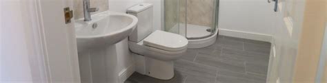 Why is my toilet backing up into my shower and how do I stop it? | Cinch Home Services