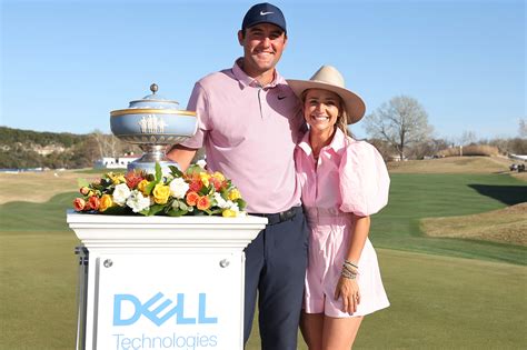 Scottie Scheffler hugs wife Meredith after Players Championship win