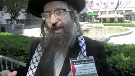 Two Neturei Karta explain anti-Zionism at Israel Parade 2012 - YouTube