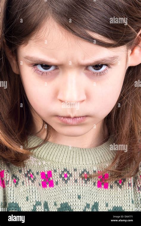 Angry girl face in close-up Stock Photo - Alamy