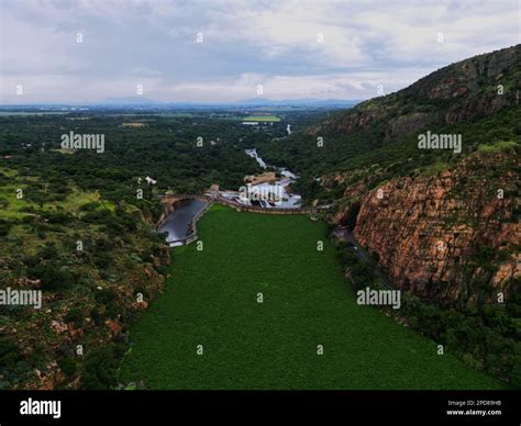 An aerial view of the Hartbeespoort Dam wall in South Africa, with lush ...