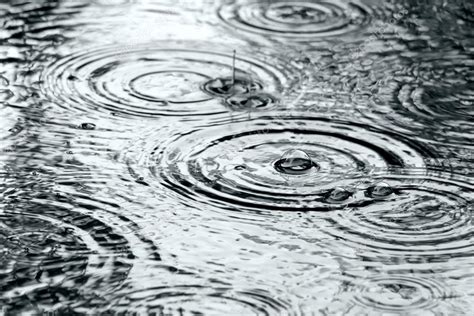 Raindrops on water surface — Stock Photo © MrTwister #31565889