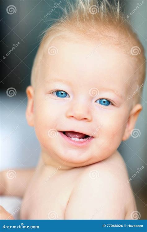 Baby boy with blue eyes stock photo. Image of indoor - 77068026