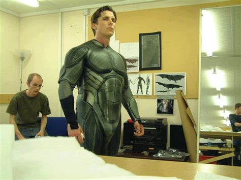 Christian Bale tries on part of the BATMAN BEGINS batsuit for the first ...