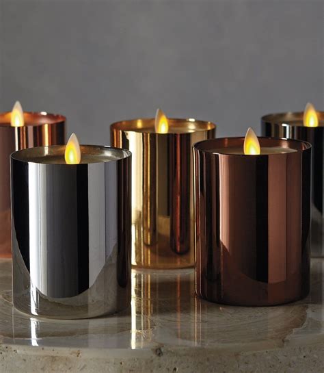 Shiny metallic vessels add holiday flair to our ivory-colored faux ...