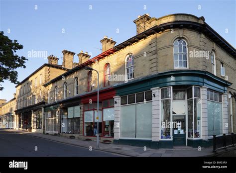 Shops on Victoria Road, in Saltaire, a UNESCO World Heritage Site in Bradford, West Yorkshire ...