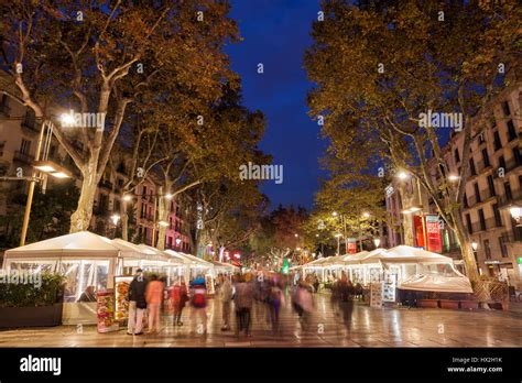 La Rambla (Las Ramblas) tree-lined boulevard witch cafes at night in ...