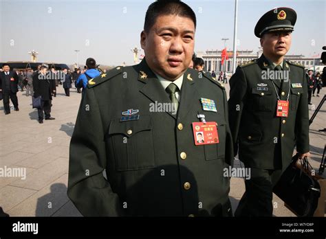 Chinese general Mao Xinyu, center, the grandson of Mao Zedong, arrives at the Great Hall of the ...