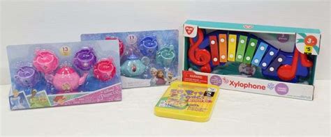 13-Piece Disney Frozen tea set, 13-Piece Disney Princess tea set, a Xylophone, and CD with 50 ...