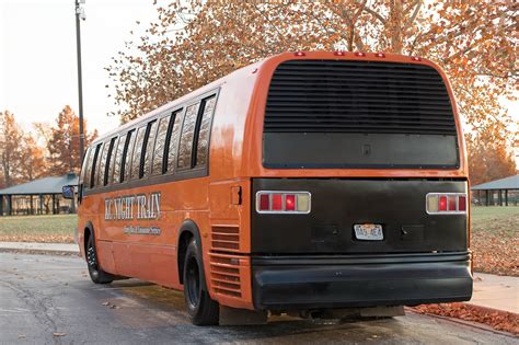 Orange Party Bus (Exterior, Rear, Driver’s Side) | KC Night Train