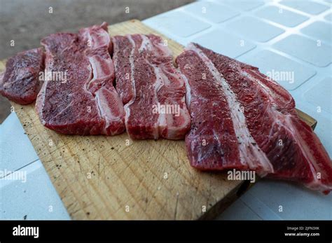 Typical Uruguayan and Argentine Asado Cooked on fire. Entrana and Vacio ...