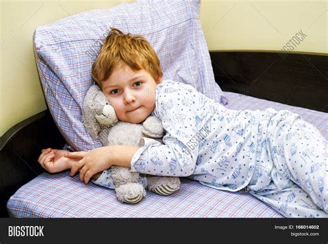 Boy Pajamas Lying Bed Image & Photo (Free Trial) | Bigstock