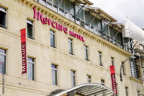 mercure hotel text and sign logo on large building facade in city Stock Photo | Adobe Stock