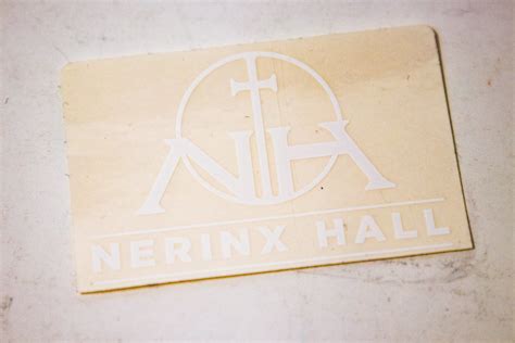 Nerinx Hall white logo decal on clear background