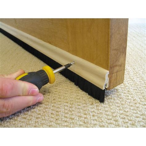 The Stormguard brush bottom door strip draught excluder seals gaps up to 25mm under the door to ...