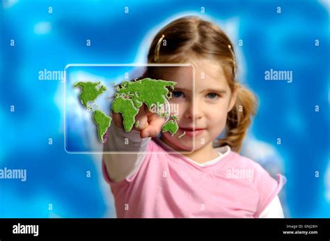 girl pointing a finger to a screen with green earth map - concept for protect earth for future ...