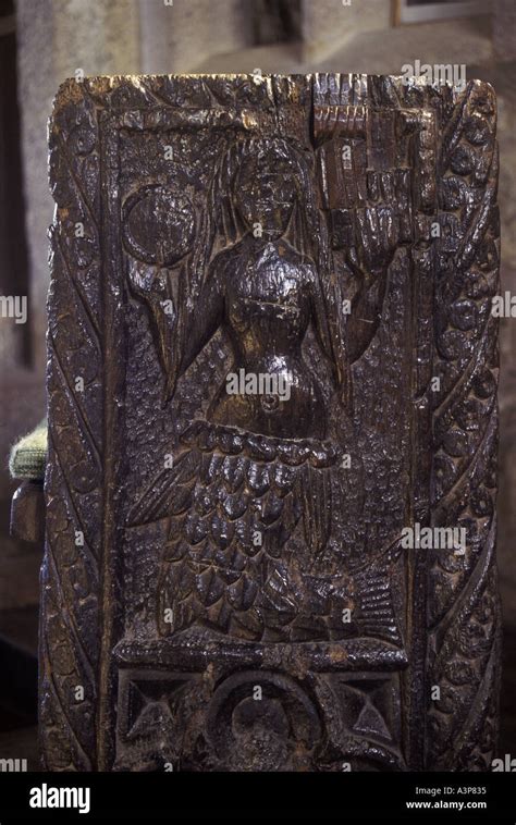 Carving of the Mermaid of Zennor on a pew in the church at Zennor ...