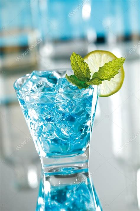 Blue mojito cocktail with blue curacao. — Stock Photo © hansgeel #116239138