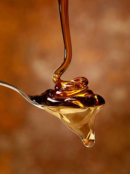 Pouring Honey Stock Photos, Pictures & Royalty-Free Images - iStock