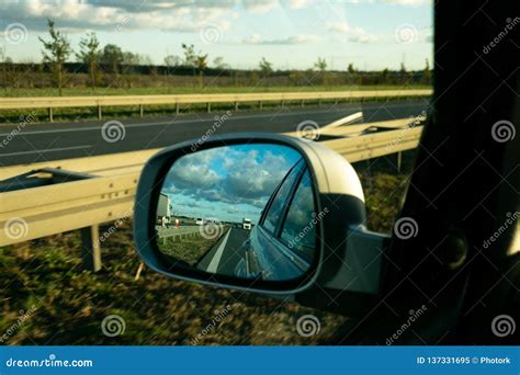 Road in the Rearview Mirror Stock Image - Image of line, motorway: 137331695