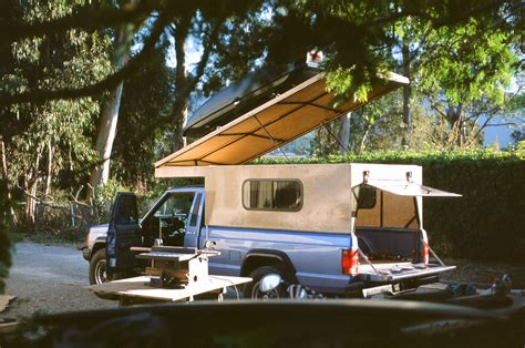 a truck with a camper attached to the back