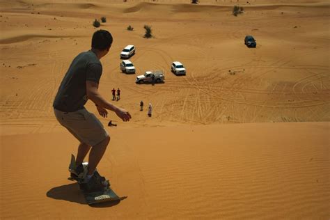 Sandboarding in the Dubai desert - Surf The Sand