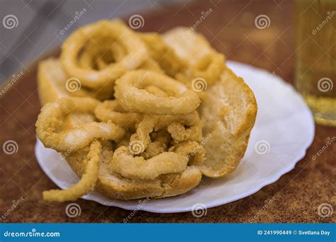 Spanish Fried Calamari Sandwich and Apple Cider in a Restaurant in ...