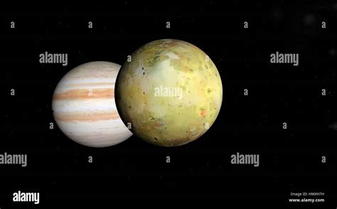 Jupiter and Io on a background of stars Stock Photo - Alamy