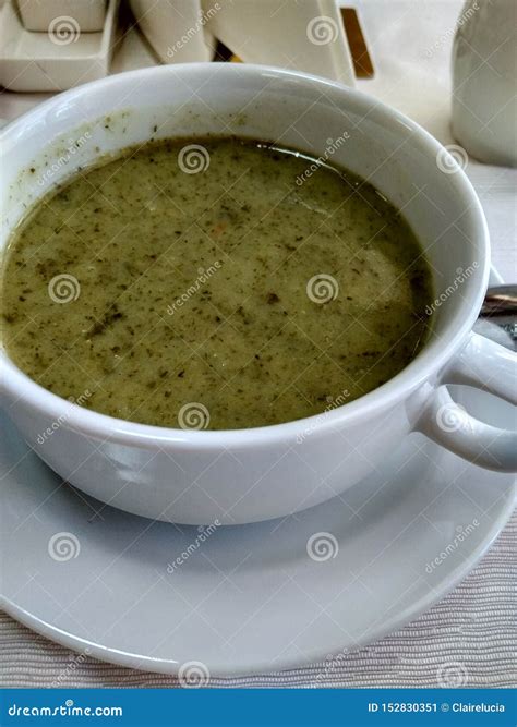 Spinach Puree Soup in a White Porcelain Bowl on the Table Stock Image ...